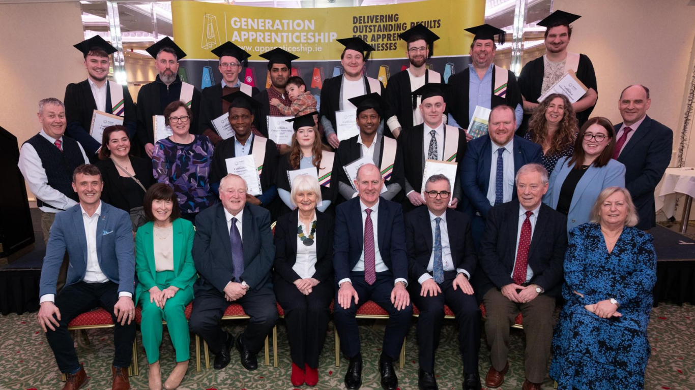 FIT tech apprenticeship graduates celebrating together at a Generation Apprenticeship graduation ceremony